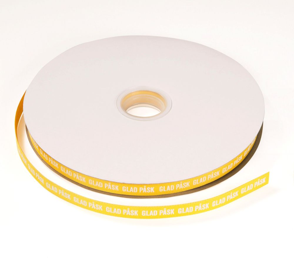 Tygband, Glad Påsk, gul med vit text, 13 mm x 100 m